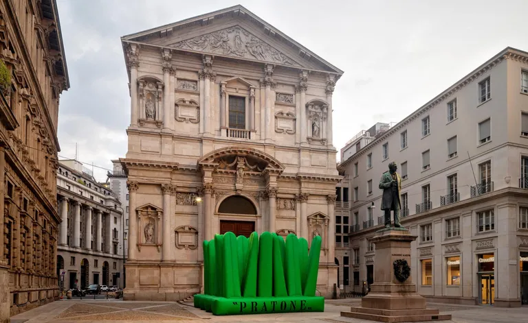 Large green inflatable Gufram Pratone installed in Piazza San Fedele, Milan