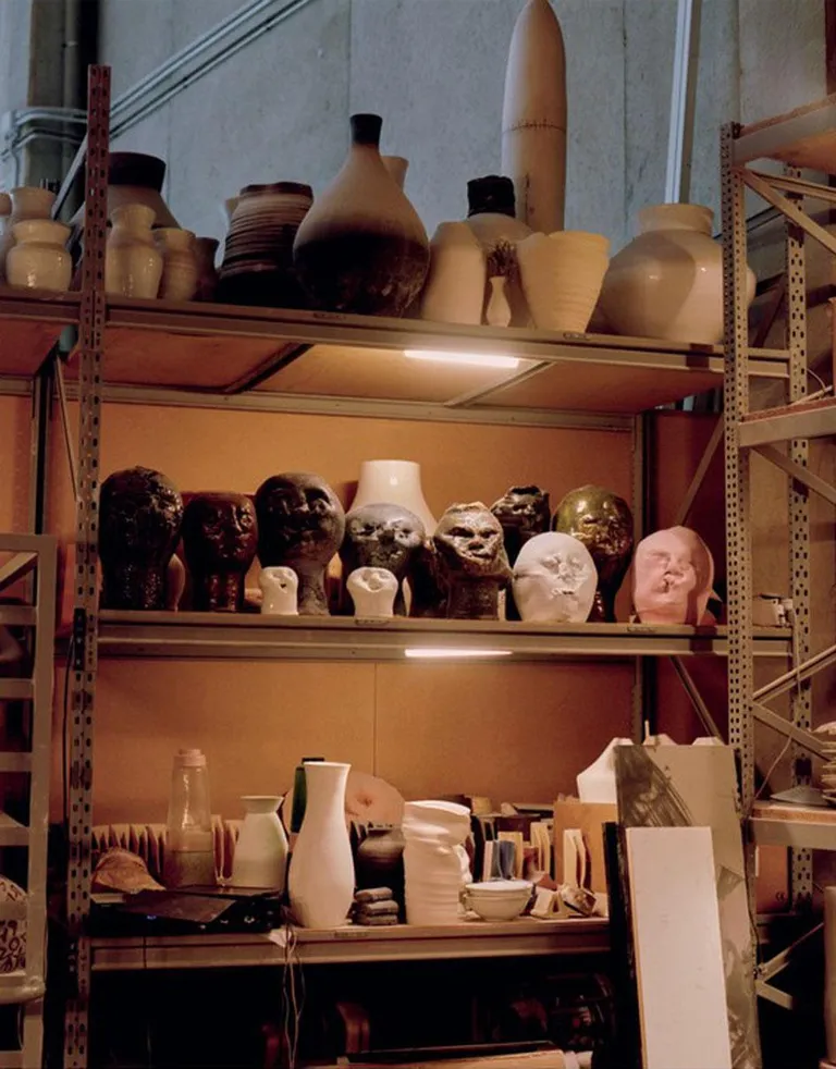 Inside the studio of ceramic artists Apparatu in Rubí, Spain with ceramic vessels on the shelf