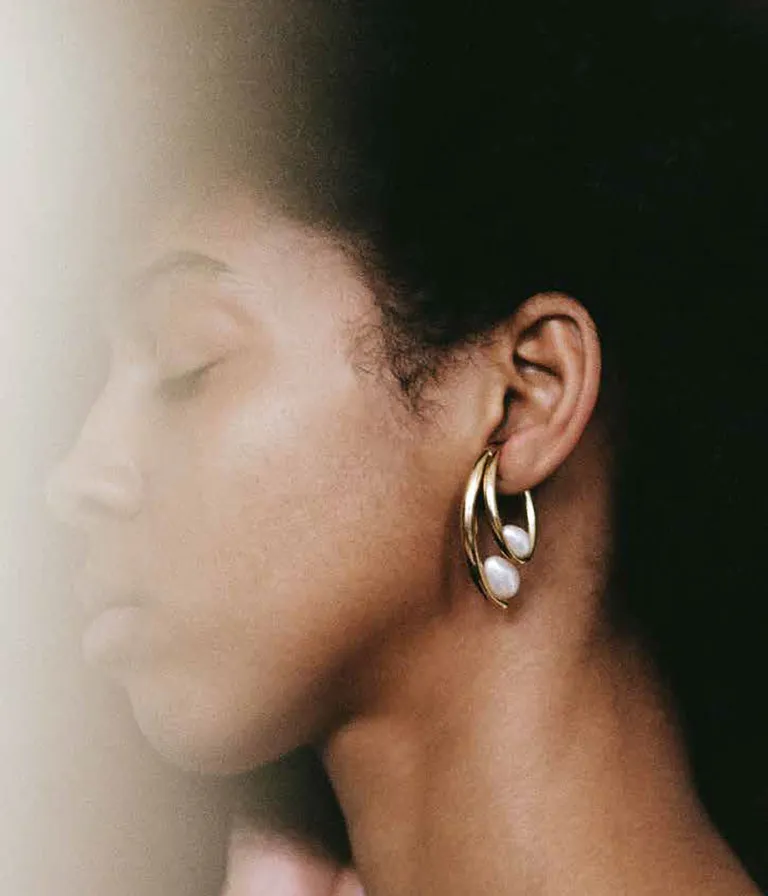 woman in pearl earring
