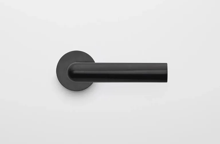 black minimalist door handle by Piet Boon