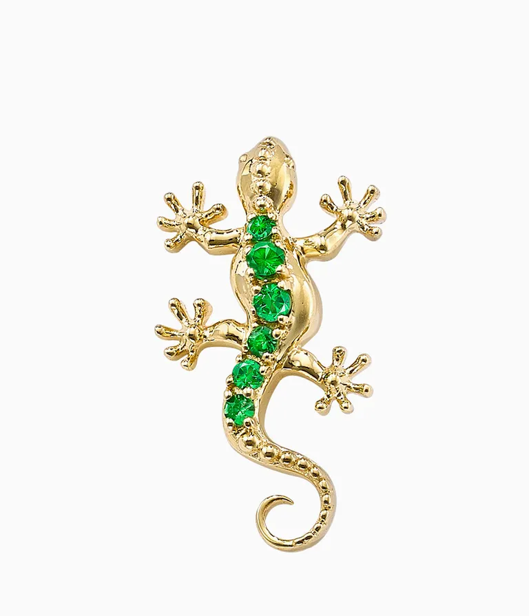 gold lizard earring with emeralds going up the back 